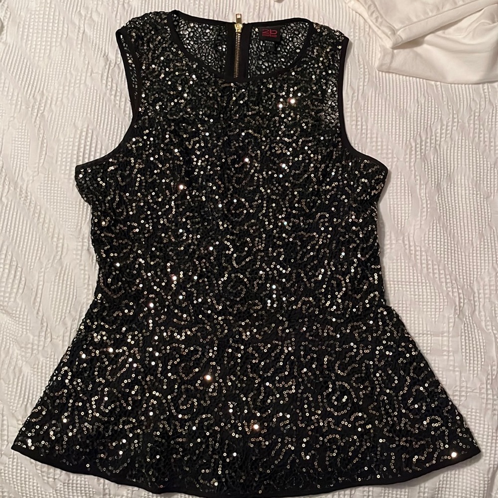Sequin peplum hem top size small